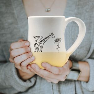 Large mug, handmade and illustrated by Darn Pottery hedgehogs, appears to have a rabbit riding a giraffe. Surely, this can't be happening. Gold accent color