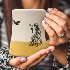 The most important moment in all of American history is portrayed on this handmade mug: vigilant hedgehog at the beach looking for the British armada. Gold accent color.