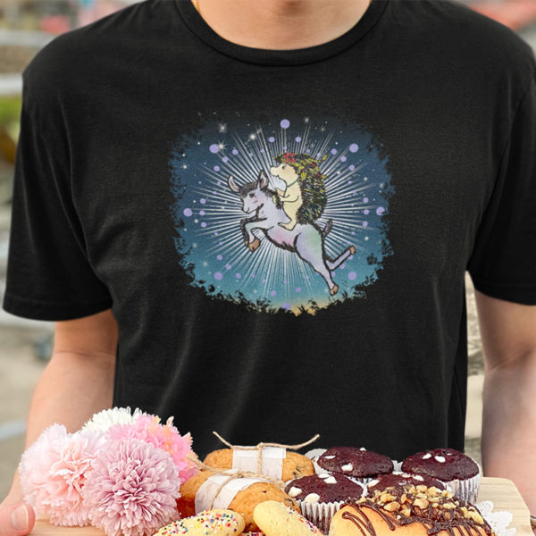 Graphic T-shirt with drawing of a hedgehog flying on a magic goat