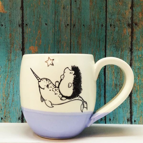 Handmade ceramic cocoa mug with drawing of hedgehog on a narwhal