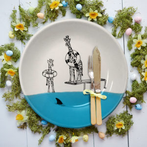 Handmade salad plate with drawing of giraffes and a shark. Blue accent color