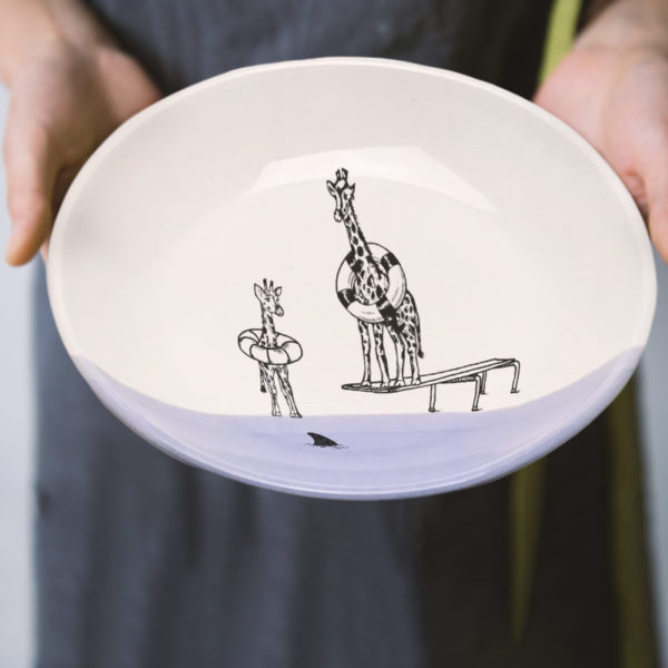 Handmade salad plate with drawing of giraffes and a shark. Lavender accent color