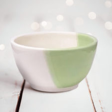 Side view of Darn Pottery Soup Bowl. Green accent color.