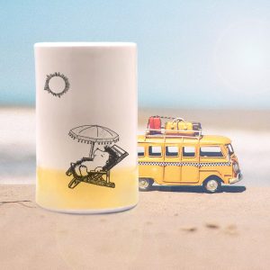 This handmade ceramic tumbler is for everyone who dreams in colors borrowed from the sea. Featuring a drawing of happy mama hedgehog relaxing under a beach umbrella. Gold accent color.