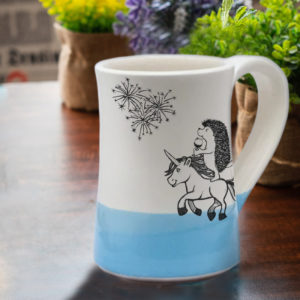 Handmade coffee mug with hedgehog on unicorn drinking wine and watching fireworks