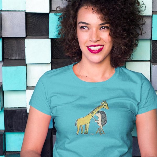 Model wearing a graphic Tshirt illustrated with original Darn Pottery artwork of hedgehog painting spots on a giraffe