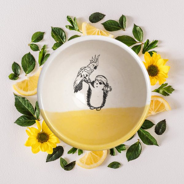 No pirate is complete without a sidekick. The parrot and the hedgehog pirate are a great team and are featured in the drawing on this handmade ceramic bowl. Gold accent color.
