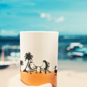 Capturing that classic pastime of reminiscing about space aliens at the beach, this handmade ceramic tumbler also does a great job of holding various tasty liquids. Coral accent color.