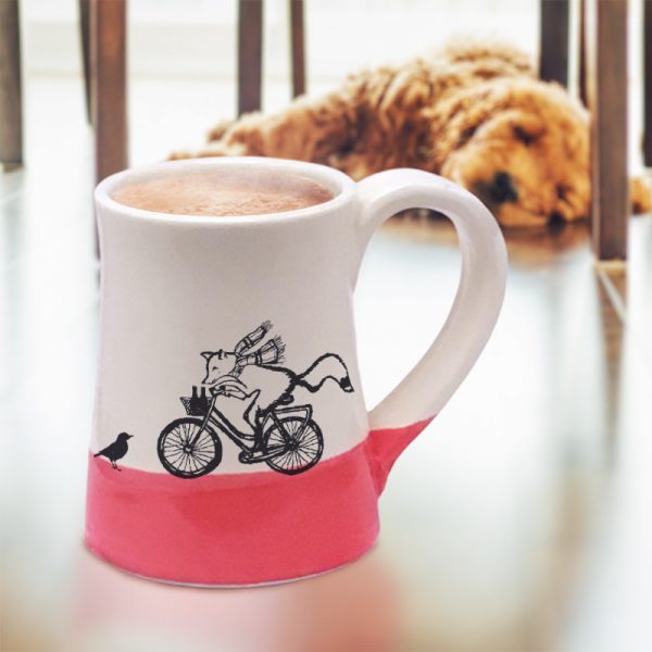 Handmade coffee mug with a drawing of a fox delivering beer on a bicycle. Now what could possibly go wrong? Red accent color.