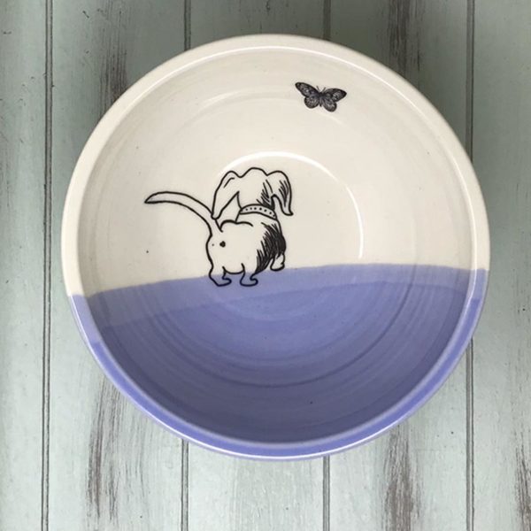 handmade ceramic soup bowl with drawing of a cute dashchund chasing a butterfly
