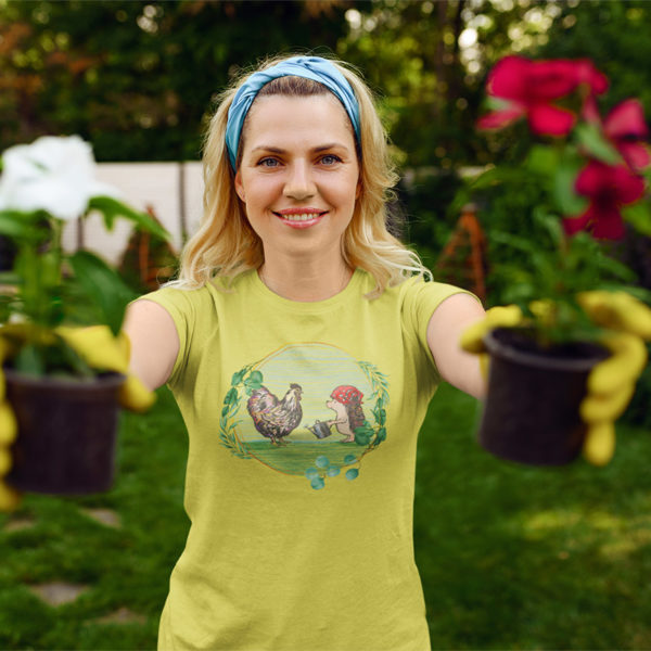 Woman wearing graphic T-shirt with original drawing of a rooster and hedgehog in the garden