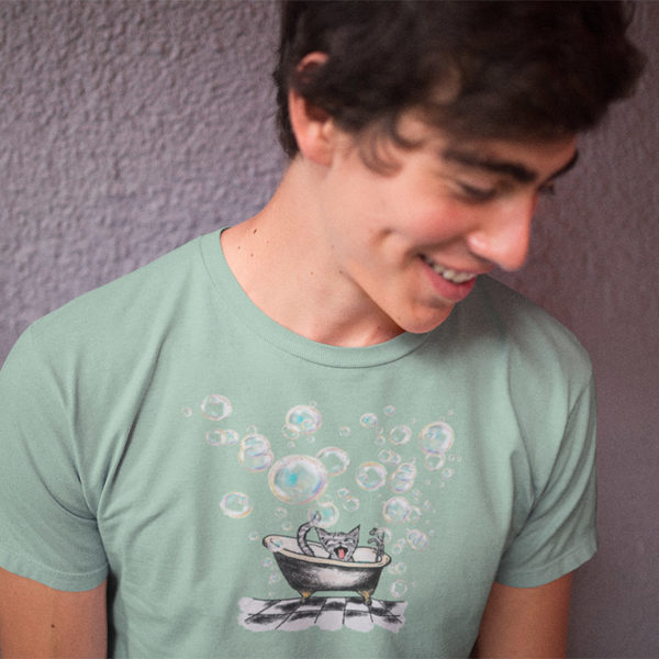 Young man wearing Tshirt with drawing of cat in vintage bathtub