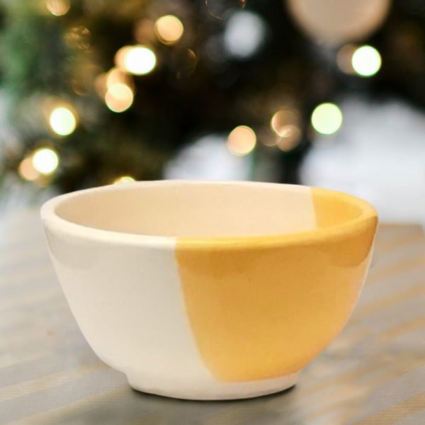 Side view of Darn Pottery Soup Bowl. Gold accent color.