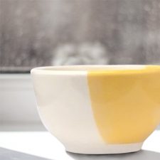 Unlikely best friends, chicken and fox are the featured drawing on this perfect soup bowl that was handmade and illustrated by the hedgehogs of Darn Pottery. Gold accent color.